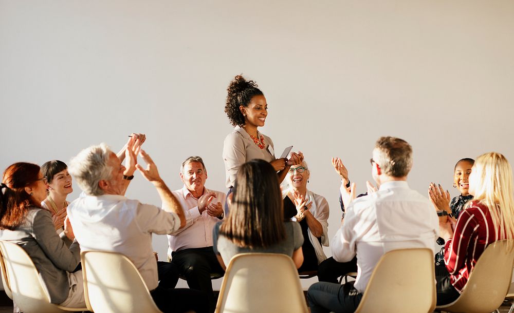 People sitting and talking with a group