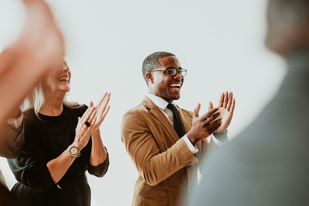 Diverse business people applauding with joy