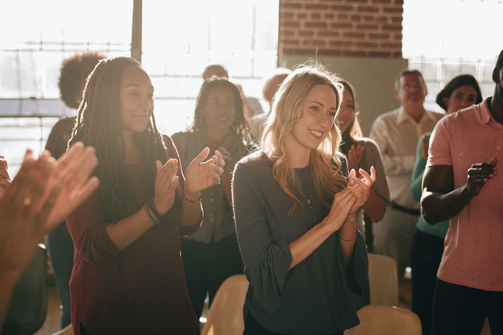 Diverse people clapping after a session