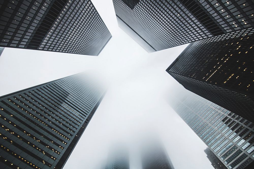 A low-angle shot of skyscrapers on a foggy day. Original public domain image from Wikimedia Commons