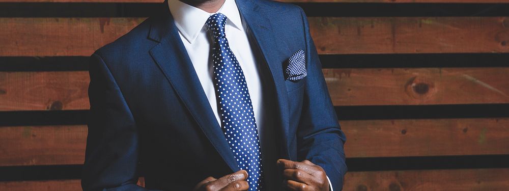 A confident man in a blue blazer. Original public domain image from Wikimedia Commons