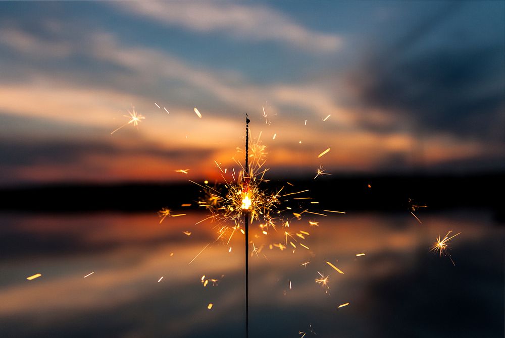 A sparkling burning firework. Original public domain image from Wikimedia Commons