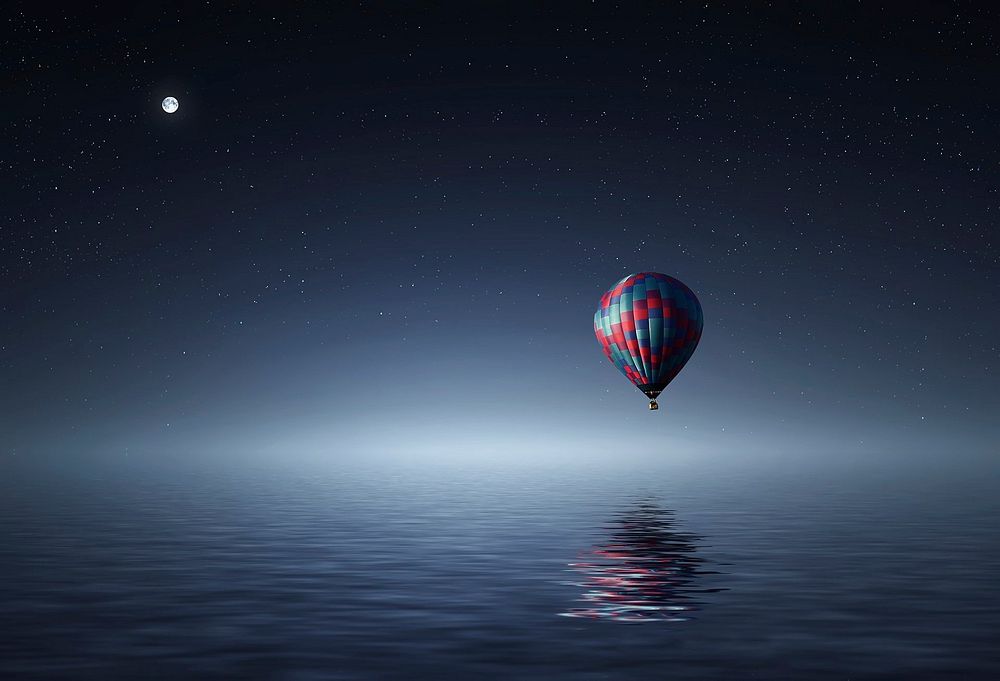 Hot air balloon over the water. Original public domain image from Wikimedia Commons