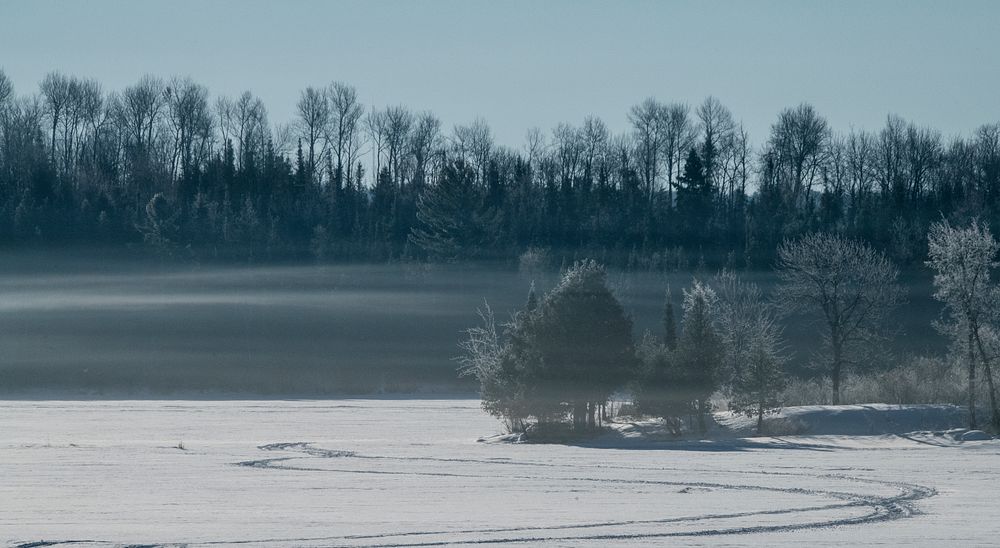A misty morning layer of vapor flows slowly over Shagawa Lake near the U.S. Department of Agriculture (USDA) Forest Service…