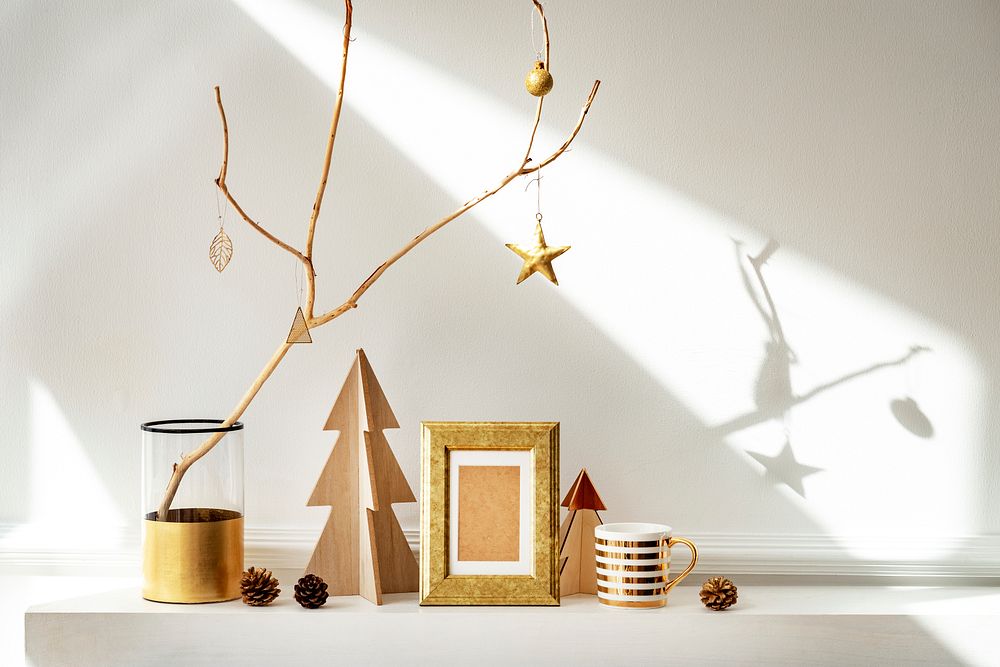 Golden frame surrounded by Christmas ornaments