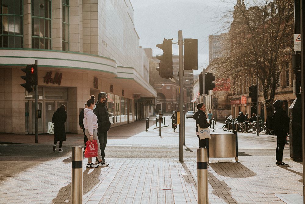 Social distancing while waiting to cross the street during coronavirus pandemic. BRISTOL, UK, March 30, 2020
