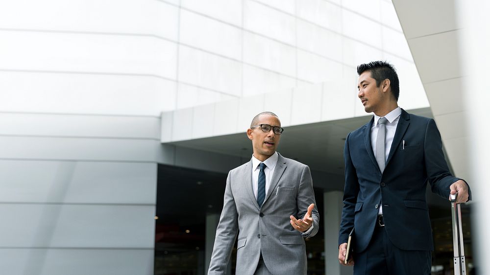 Businessmen discussing on the go