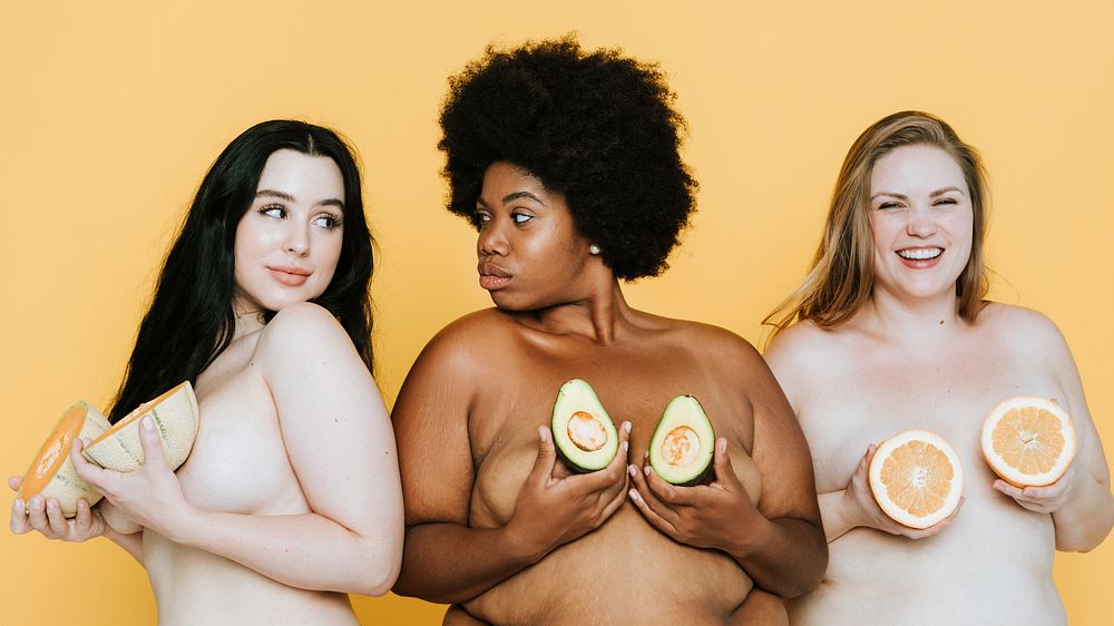 Diverse nude women holding fruits over their breasts