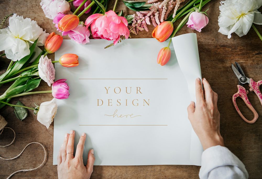 Poster mockup among colorful flowers