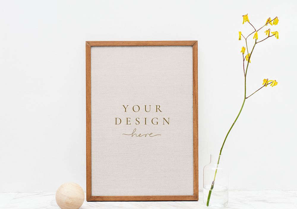 Photo frame mockup by a yellow forsythia
