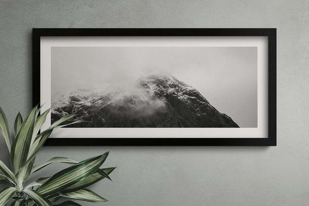 Black frame mockup on a black wall