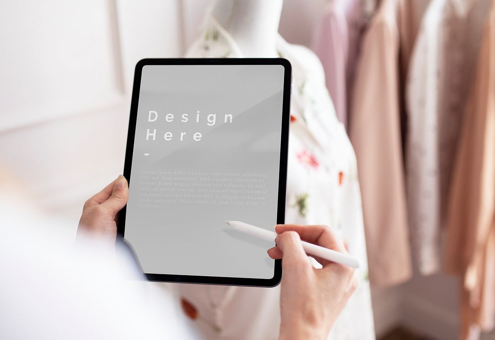 Hand holding a digital tablet mockup