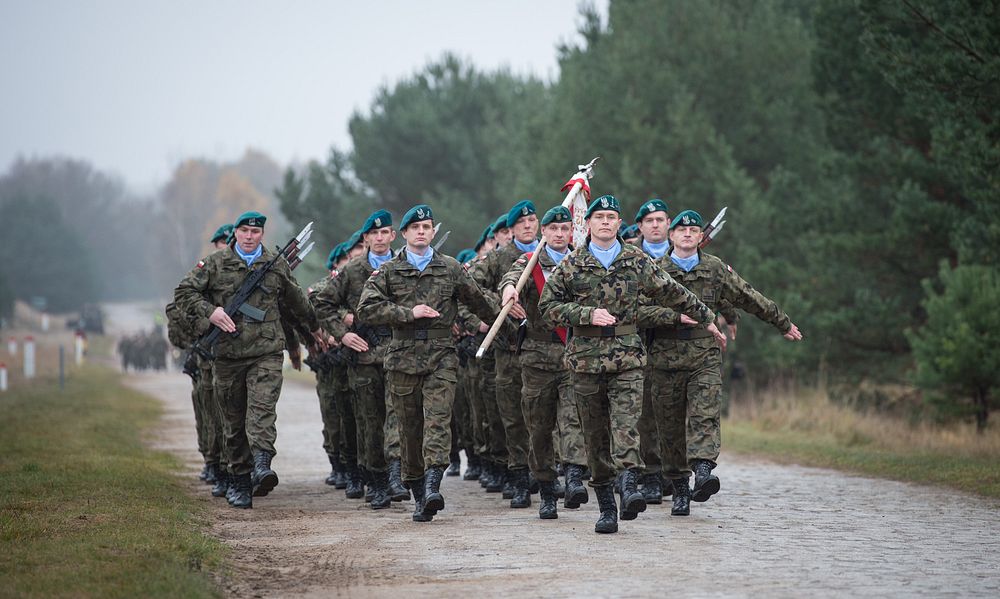 Polish service members march during the opening ceremony for exercise Steadfast Jazz 2013 in Drawsko Pomorskie, Poland, Nov.…