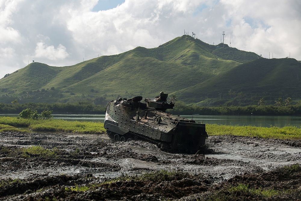 U.S. Marines with Combat Assault Company, 3rd Marine Regiment drive an assault amphibious vehicle (AAV) through the salvage…