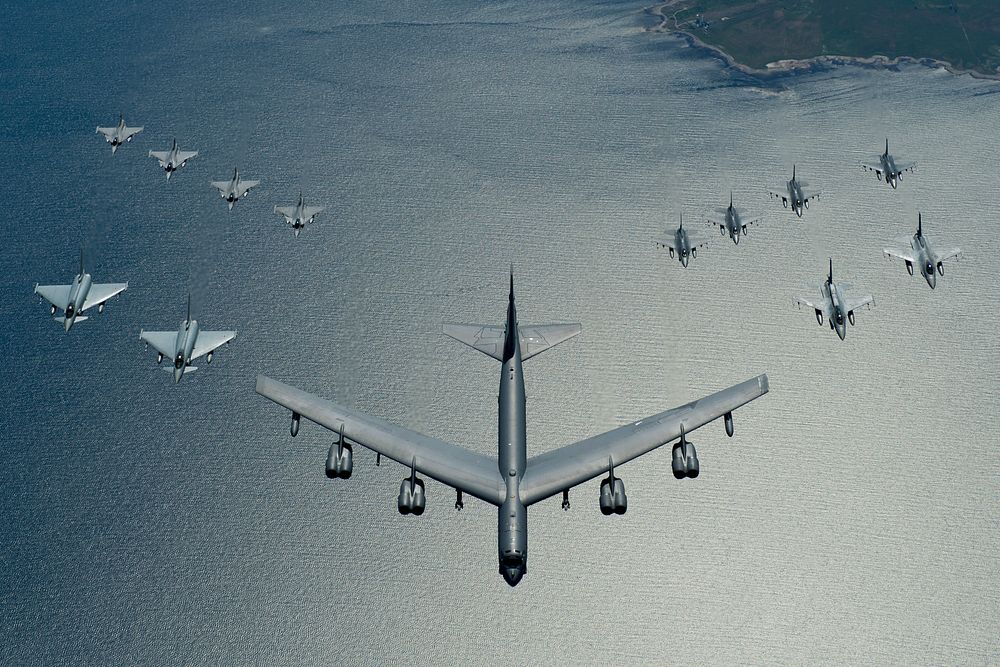 A U.S. Air Force B-52 Stratofortress leads a formation of aircraft including two Polish air force F-16 Fighting Falcons…