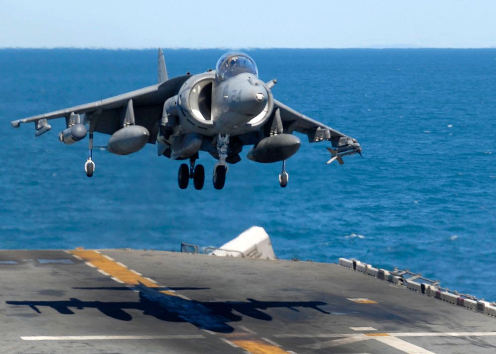 A U.S. Marine Corps AV-8B Harrier aircraft attached to Marine Attack Squadron 211, embarked aboard the forward-deployed…