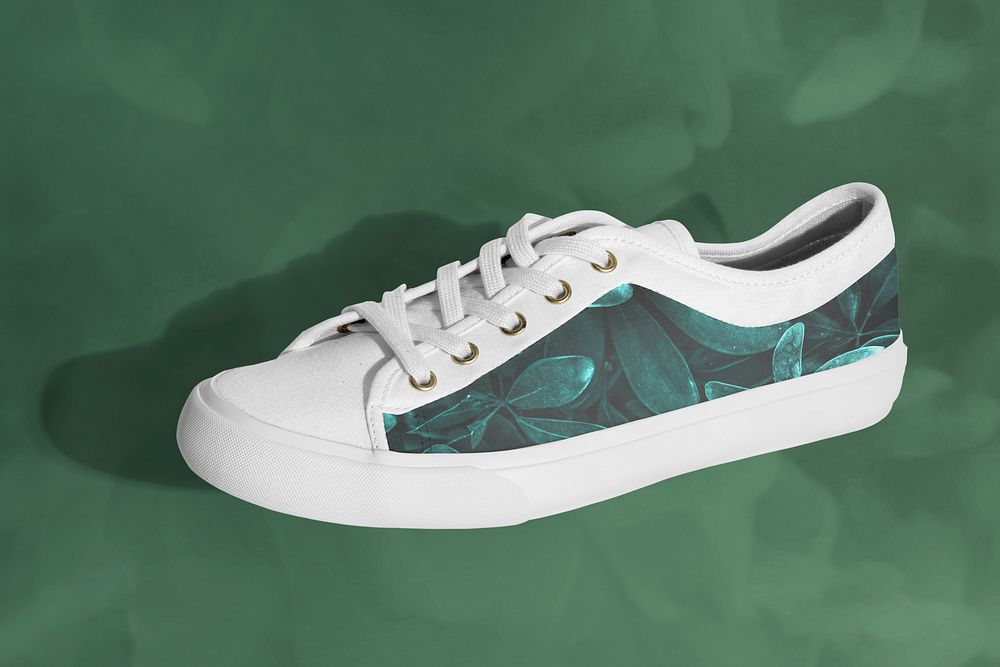 Unisex sneakers mockup with leaf pattern on a green background