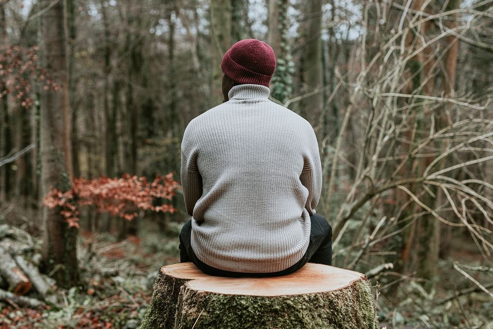 Men's turtleneck sweater mockup, autumn fashion, man sitting in forest rear view psd