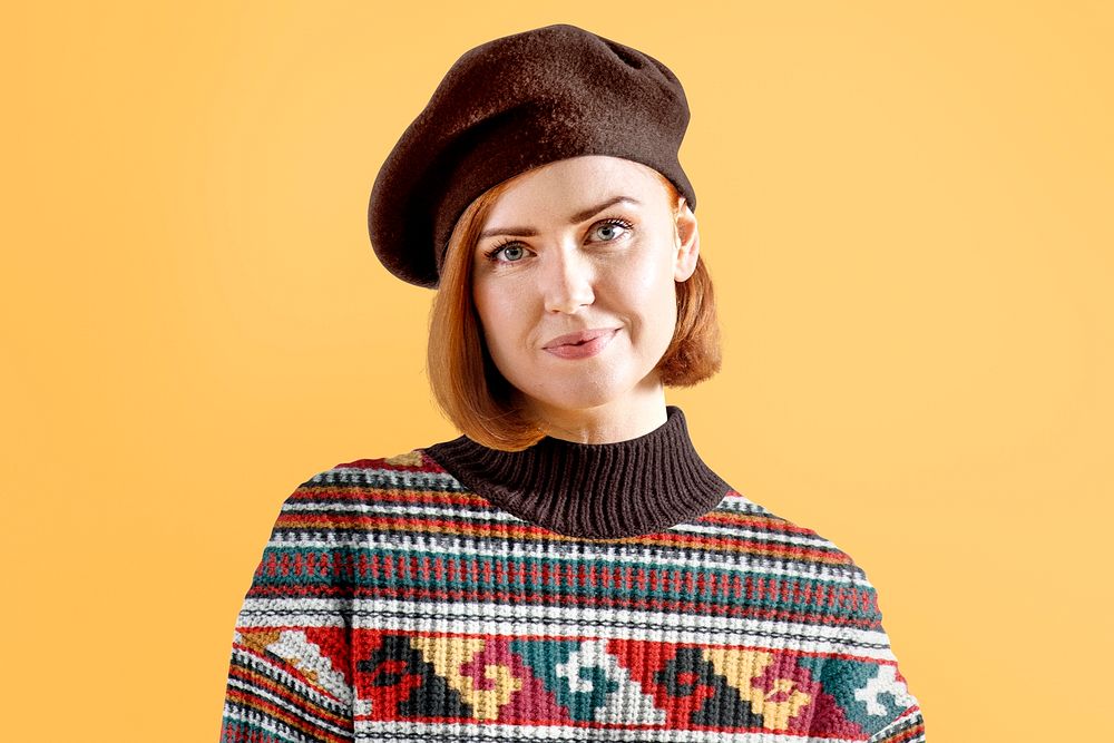 Happy woman in patterned brown sweater portrait, autumn apparel fashion design