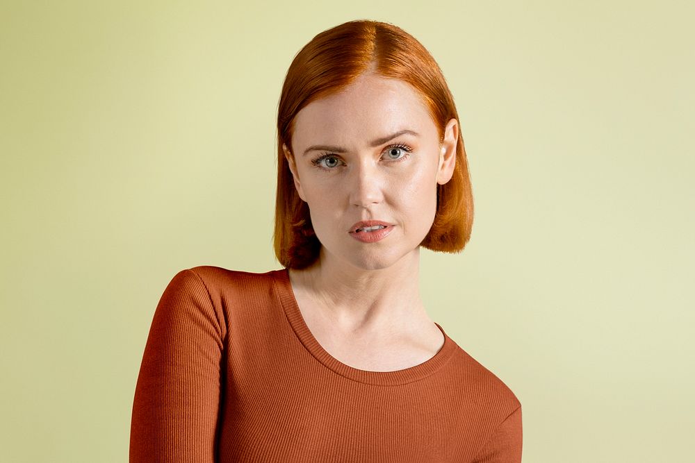 Ginger-haired woman in orange tee portrait