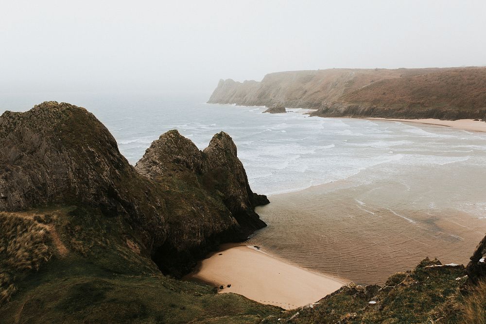 View of Three Cliff Bay in the mist, United Kingdom