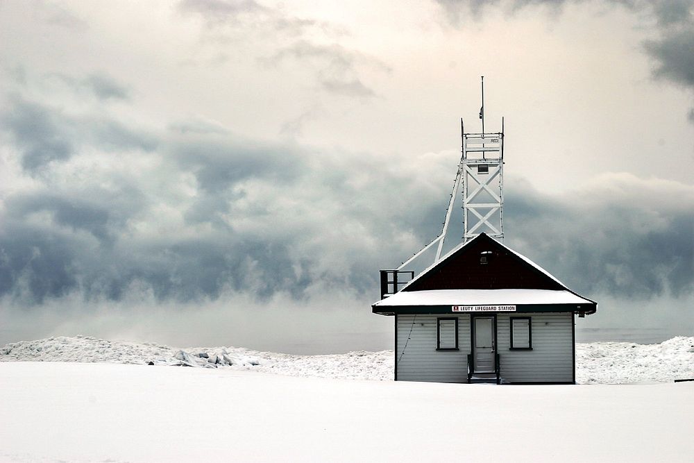 This little lifeguard station covered in snow is dreaming of the days the beach will fill up with lives that it can guard…