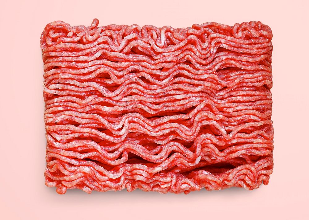 Raw ground beef on pink background, food photography