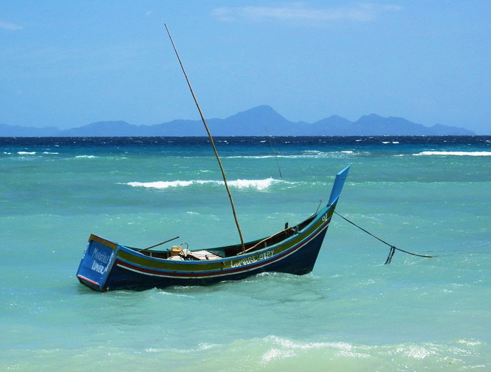 A traditional boat anchored off the coast of acehUSAID photo. Original public domain image from Flickr