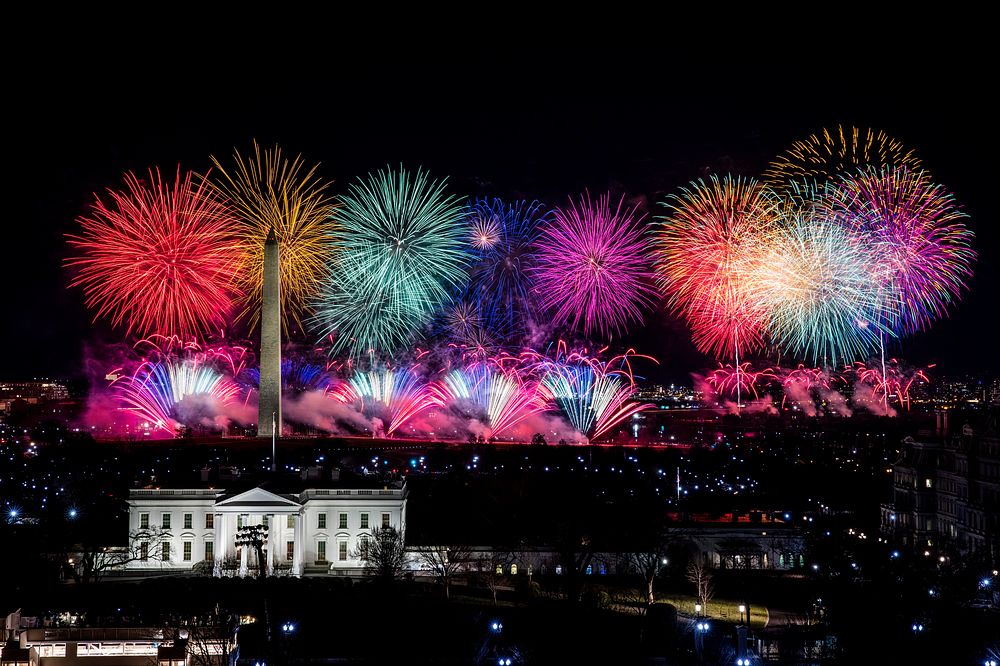 Fireworks illuminate the sky over the White House Wednesday, Jan . 20, 2021, in honor of the inauguration of President Joe…
