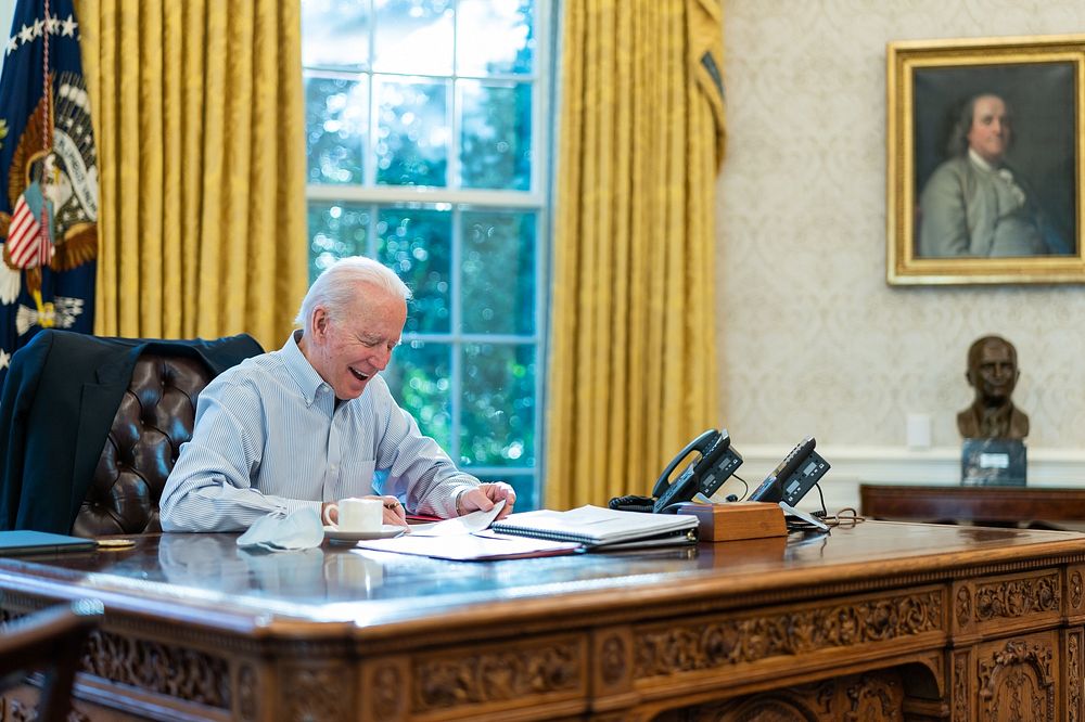 President Joe Biden talks on the phone with British Prime Minister Boris Johnson Saturday, Jan. 23, 2021, in the Oval Office…