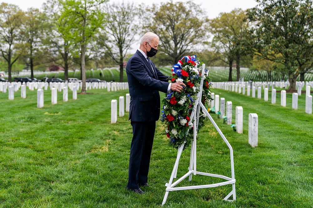 President Joe Biden lays a wreath and observes a moment of silence during a visit to Section 60 Wednesday, April 14, 2021…