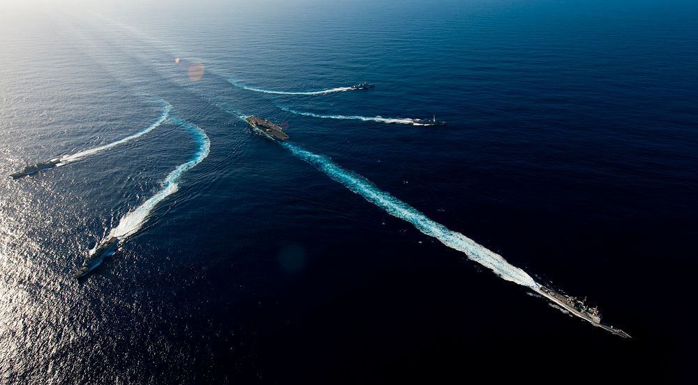 Ships assigned to the John C. Stennis Carrier Strike Group transit the Pacific Ocean during a photo exercise Feb. 14, 2012.