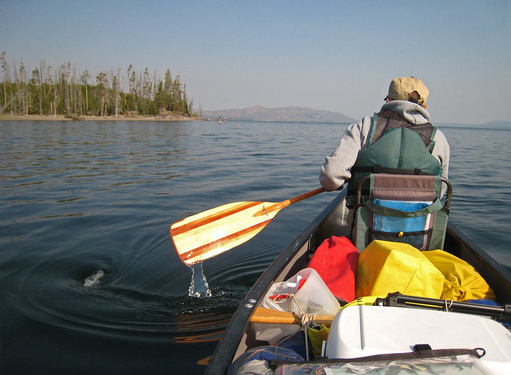 Paddling in Yellowstone LakeCanoeing in Southeast Arm of yellowstone Lake by Jim Peaco. Original public domain image from…