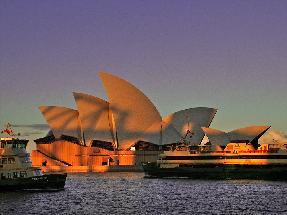 Harbour Bridge shadow on the Opera House.Sydney Opera House with the shadow of the Harbor bridge on it at sun set, Sydney…