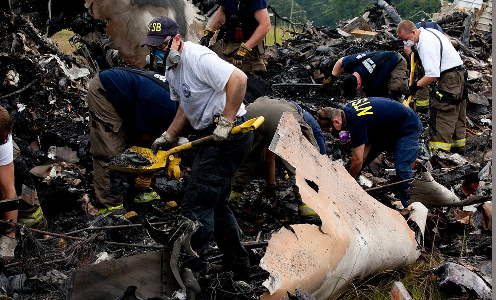 Investigators combing through wreckage from UPS flight 1354Original public domain image from Flickr
