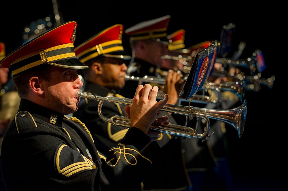 U.S. Soldiers with the U.S. Army Band perform a final musical salute Aug. 16, 2013, during a retirement ceremony in honor of…