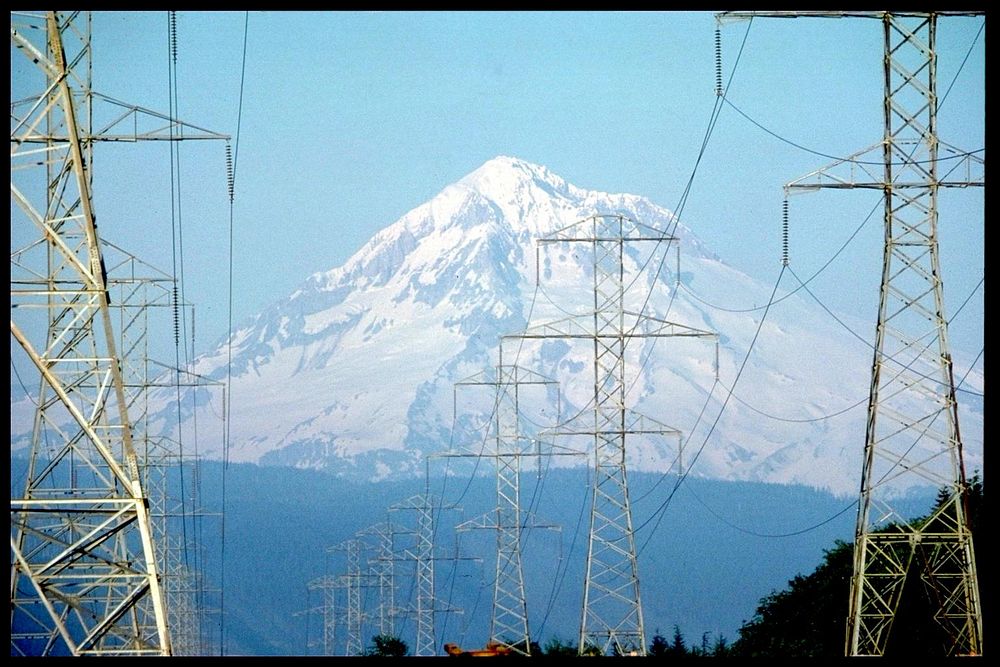 Mount hood with transmission towers and lines in foreground.