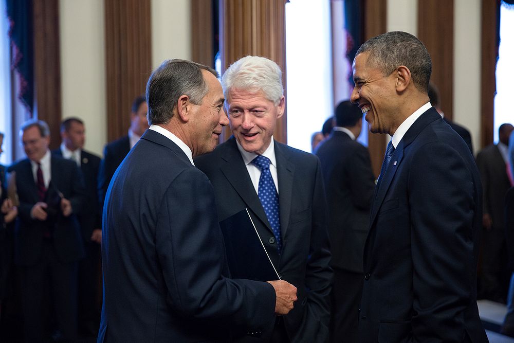 President Barack Obama and former President Bill Clinton speak with House Speaker John Boehner, R-Ohio, before a memorial…