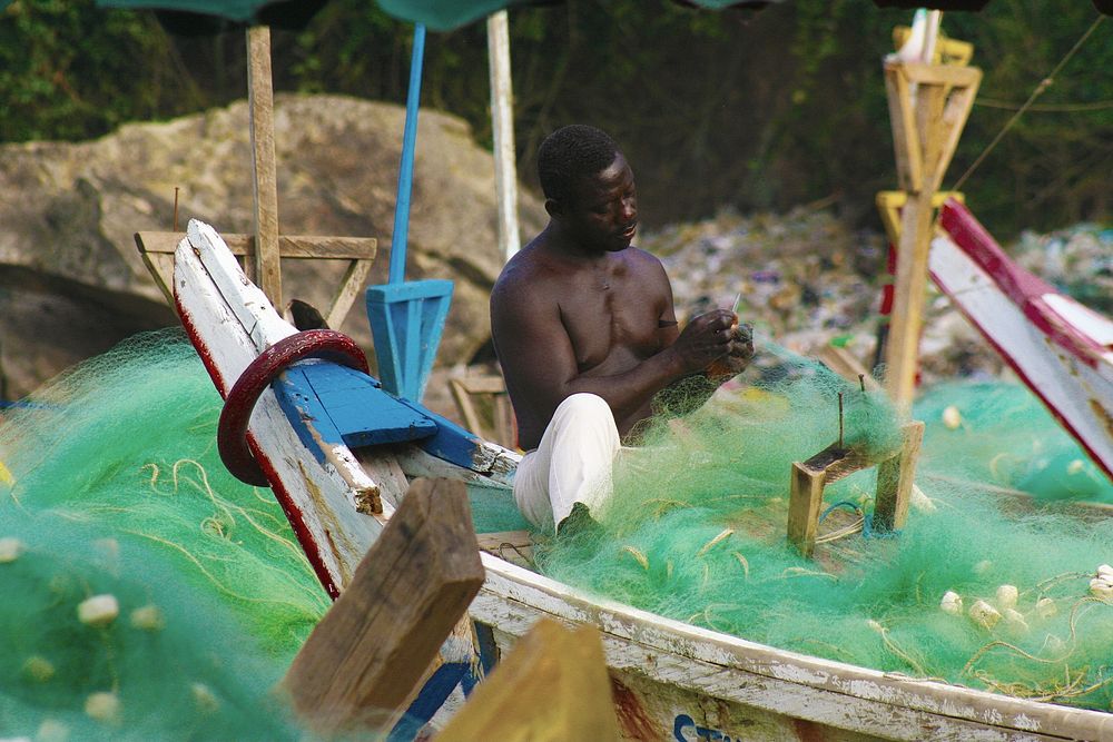 Fish Boosts Food Security. A fisherman mends his nets in Ghana's Cape Coast.USAID&rsquo;s integrated coastal fisheries…