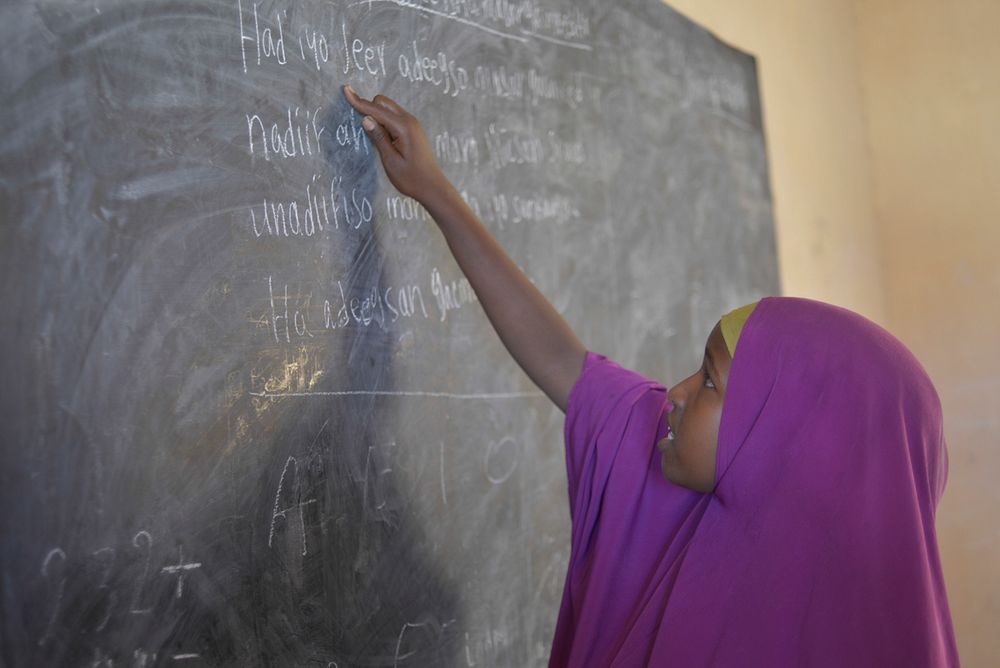 A class two student reads from the blackboard at HajjiI Mohamud Hilowle Primary School in Mogadishu. The school was built by…