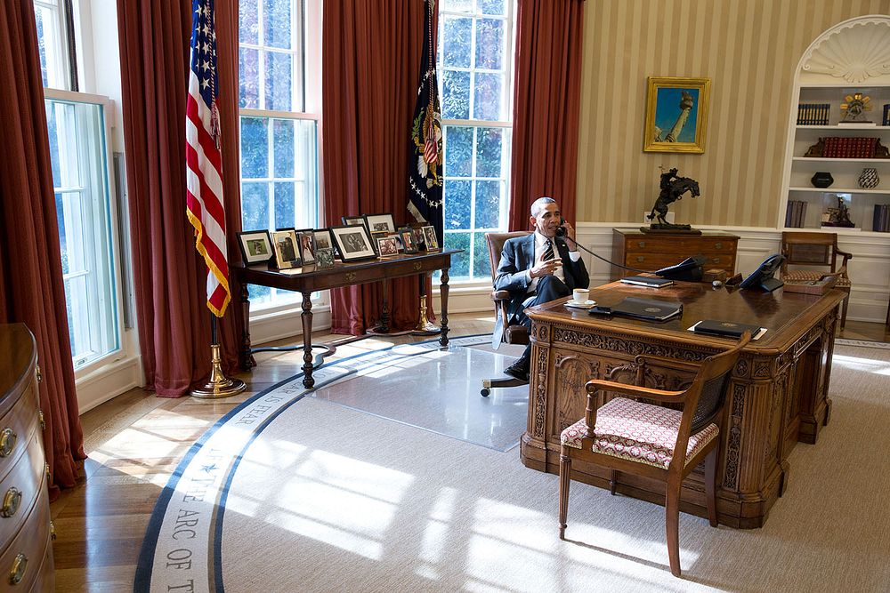 President Barack Obama talks on the phone with House Speaker John Boehner, R-Ohio, in the Oval Office, Feb. 5, 2014.