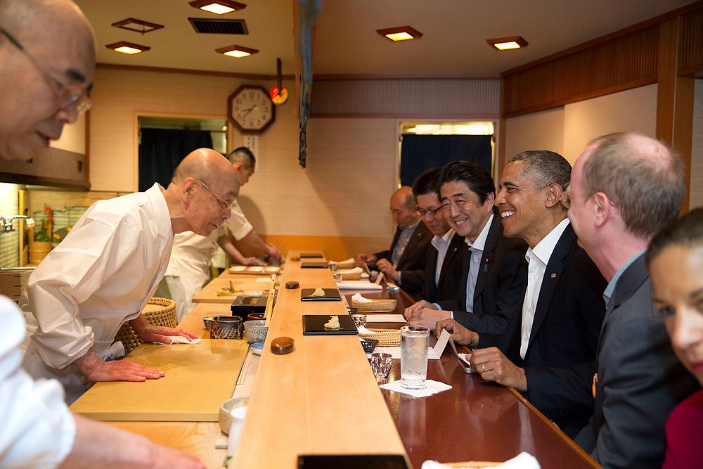 President Barack Obama and Prime Minister Shinzo Abe of Japan talk with sushi master Jiro Ono, owner of Sukiyabashi Jiro…
