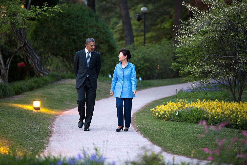 President Barack Obama and President Park Geun-hye walk in the Little Garden at the Blue House in Seoul, Republic of Korea…