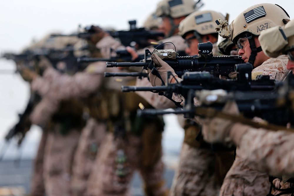 U.S. Marines with Force Reconnaissance Detachment, 11th Marine Expeditionary Unit execute close quarters combat drills using…