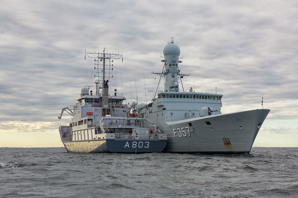 The Dutch hydrographic survey vessel HNLMS Luymes (A803), left, comes alongside the Danish ocean patrol vessel HDMS Thetis…