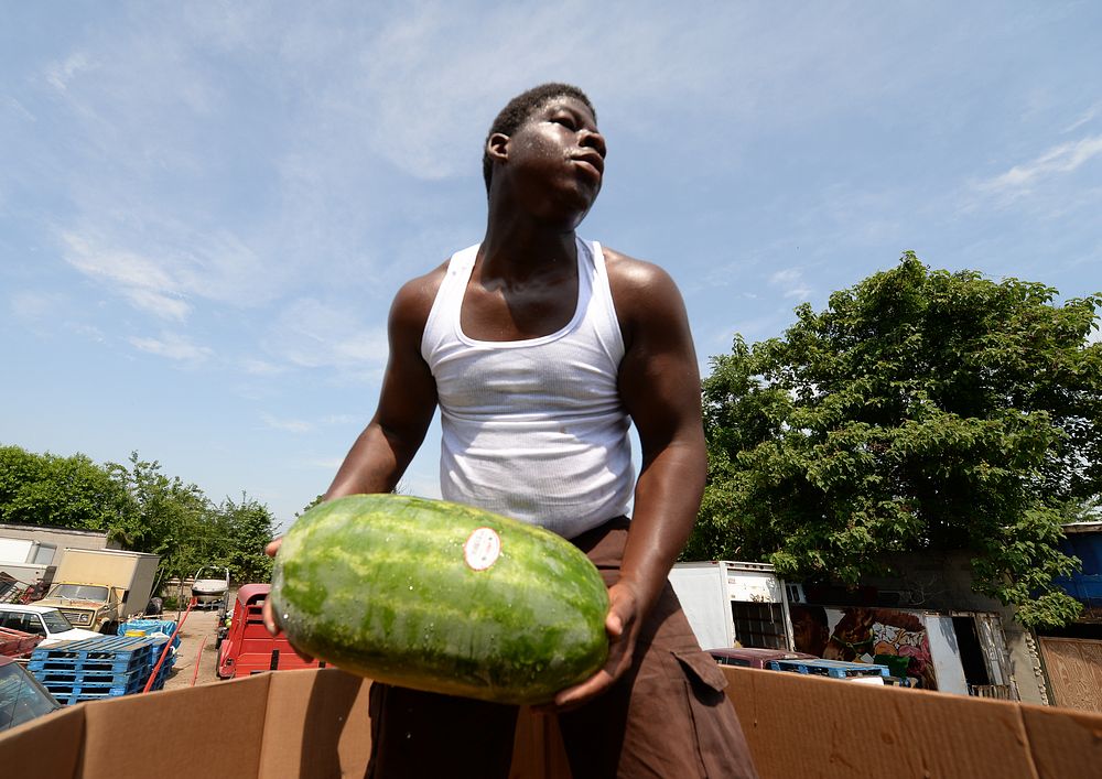Watermelons get loaded onto a truck at the Arabers stable in Baltimore, MD., June 18, 2014. Street Arabers have been vending…