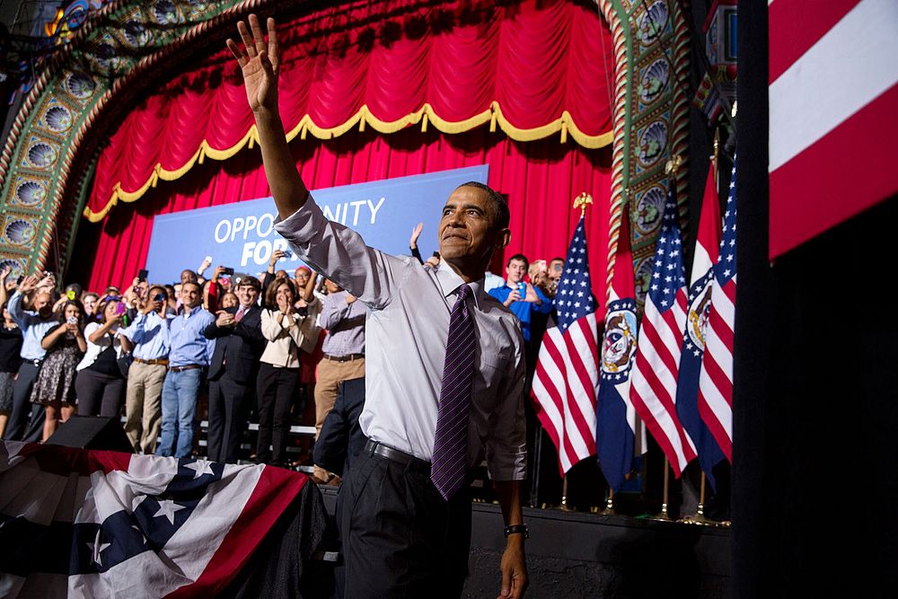 President Barack Obama waves as he departs after delivering remarks on the economy at the Uptown Theater in Kansas City…