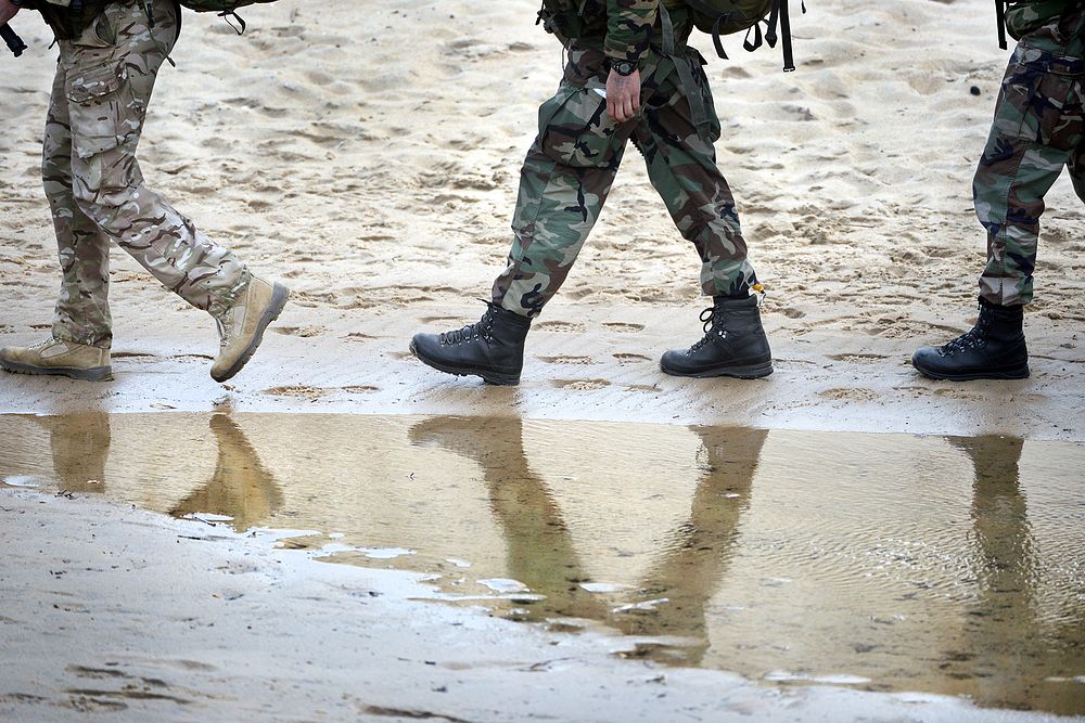 Soldiers from the Netherlands walk along a beach during Bold Alligator 2014 at Fort Story, Va. Oct. 31, 2014.