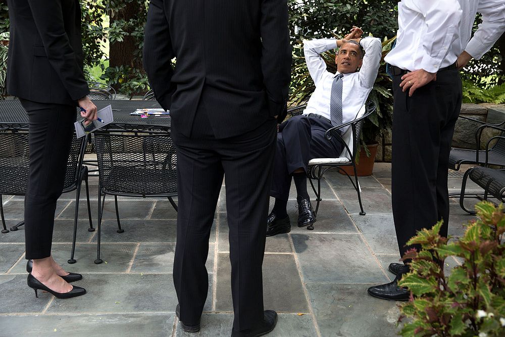 President Barack Obama talks with Chief of Staff Denis McDonough, right, National Economic Council Deputy Director Brian…