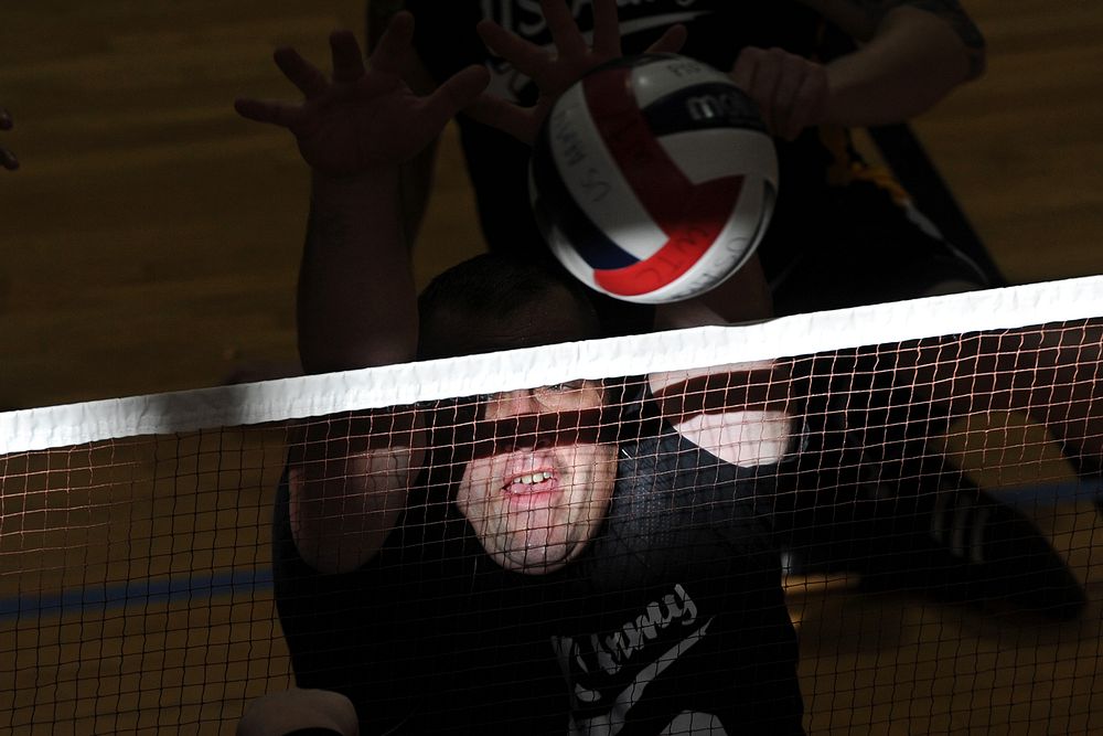 Retired Army Sgt. Sean Hook defends the net during the Fourth Annual Joint Services Sitting Volleyball Tournament for…